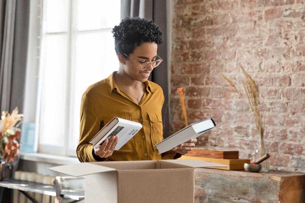 hardcover-book-printing-services A woman receiving her books from Rocky Heights hardcover book printing services
